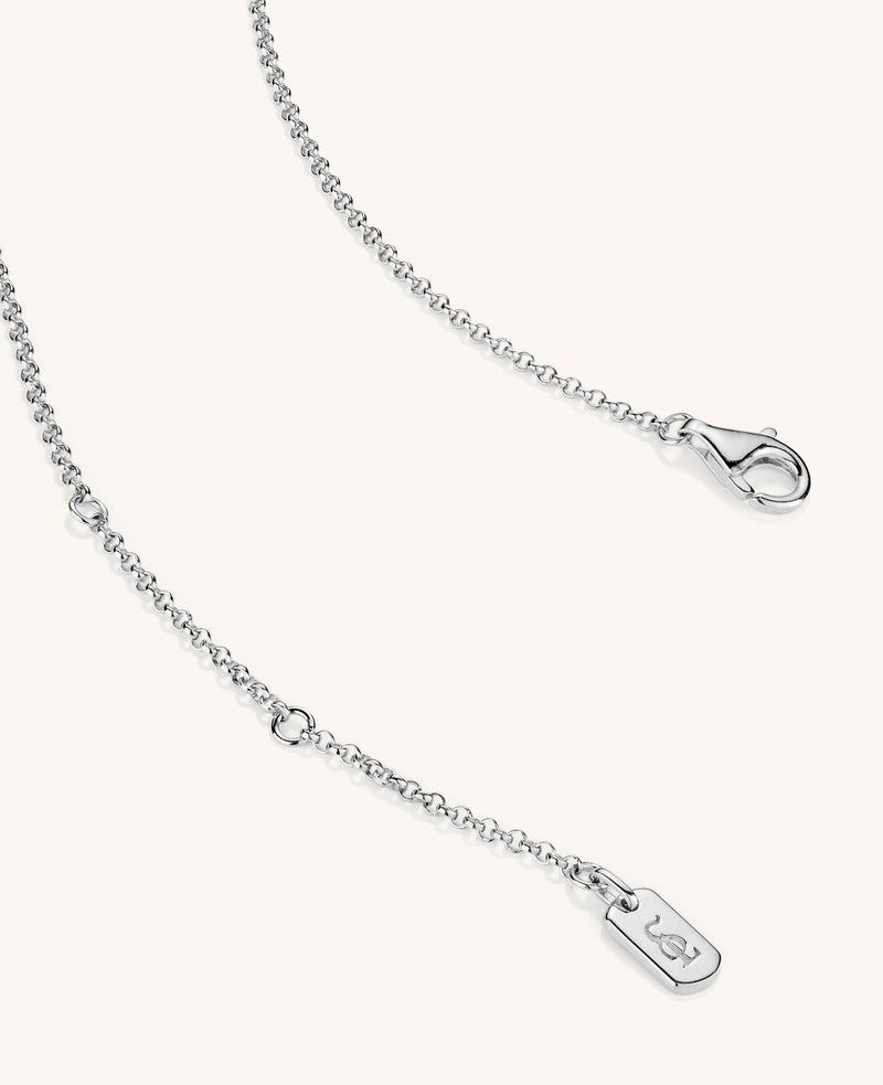 Silver chain necklace with a clasp on a white background
