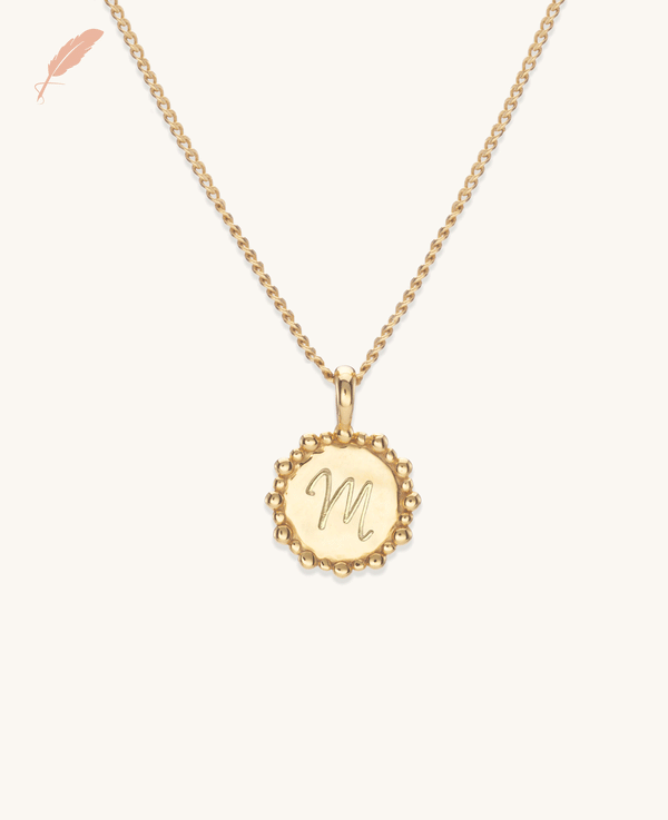 Gold initial necklace with a custom engraved letter on a gold vermeil chain